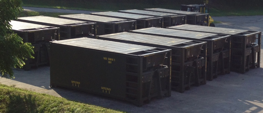 Multiple Military Refrigerated A-Frame Containers on concrete